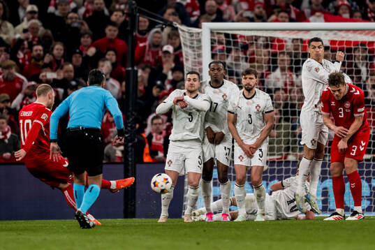 Christian Eriksen of Denmark and Diogo Dalot, Rafael Leao,