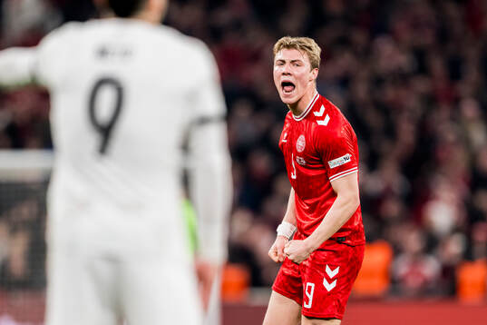 Rasmus Højlund of Denmark celebrates