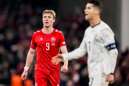Rasmus Højlund of Denmark and Cristiano Ronaldo of Portugal