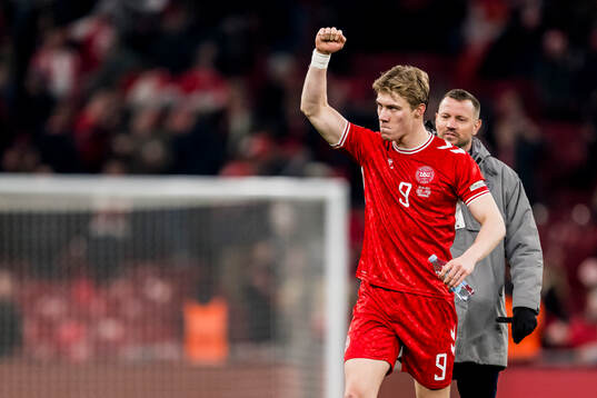 Rasmus Højlund of Denmark celebrates