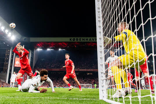 Morten Hjulmand and Joakim Mæhle of Denmark against Renato