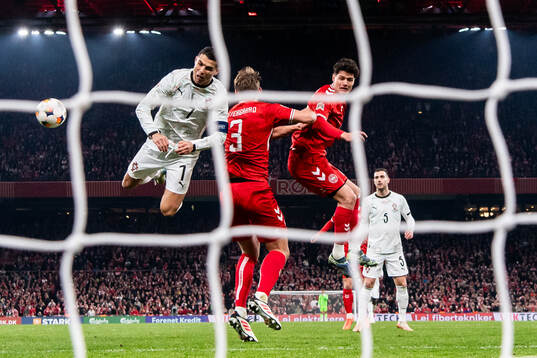Cristiano Ronaldo of Portugal against Jannik Vestergaard an