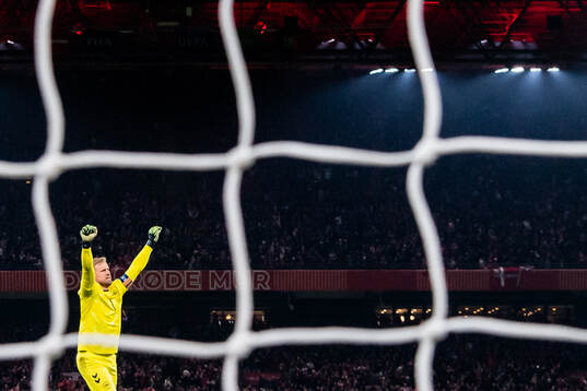 Goalkeeper Kasper Schmeichel of Denmark celebrates the 1-0