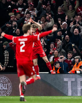 Rasmus Højlund of Denmark celebrates