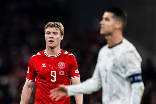 Rasmus Højlund of Denmark and Cristiano Ronaldo of Portugal