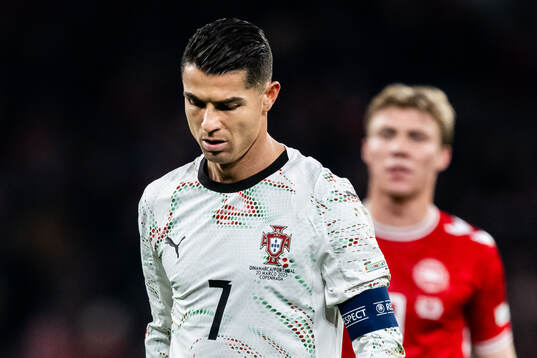 Cristiano Ronaldo of Portugal and Rasmus Højlund of Denmark
