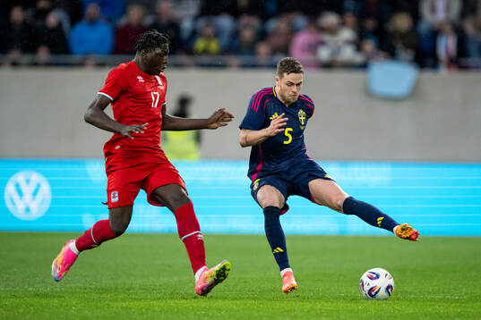 Brian Djomeni Madjo of Luxembourg and Gabriel Gudmundsson