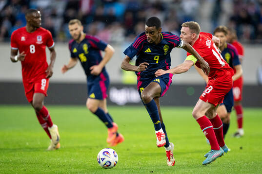 Alexander Isak of Sweden and Laurent Jans of Luxembourg