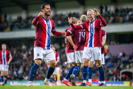 Aron Dønnum of Norway celebrates with teammate Erling