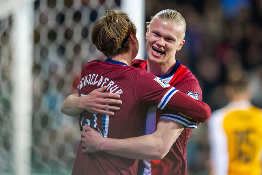 Erling Braut Haaland of Norway celebrates with teammate