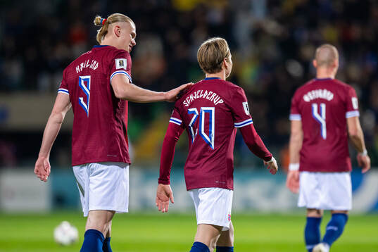 Erling Braut Haaland of Norway celebrates with teammate