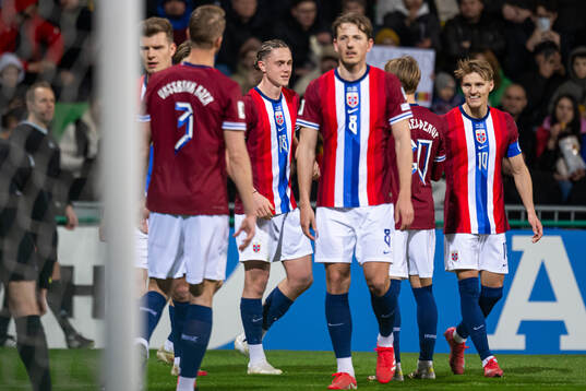 Thelo Aasgaard of Norway celebrates with teammates