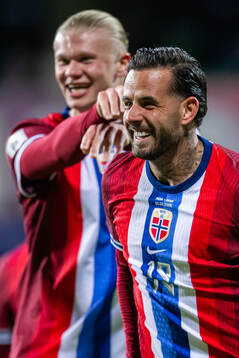 Aron Dønnum of Norway celebrates with teammate Erling