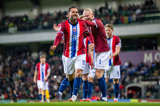 Aron Dønnum of Norway celebrates with teammate Erling