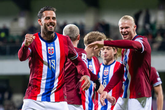 Aron Dønnum of Norway celebrates with teammate Erling
