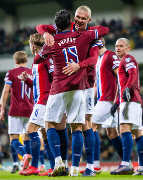 Aron Dønnum of Norway celebrates with teammate Erling