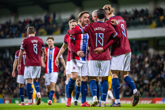 Aron Dønnum of Norway celebrates with Patrick Berg and
