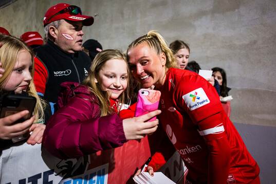 Karoline Haugland of Brann taking a selfie with a fan