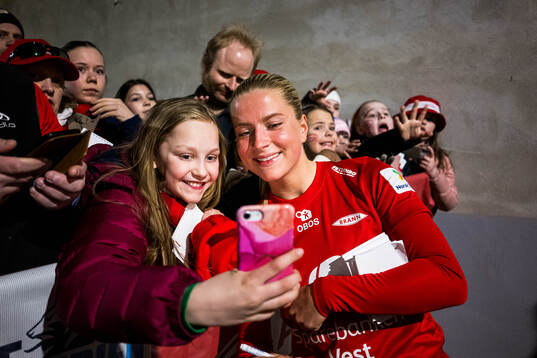 Monica Nedgård Isaksen of Brann taking a selfie with a fan
