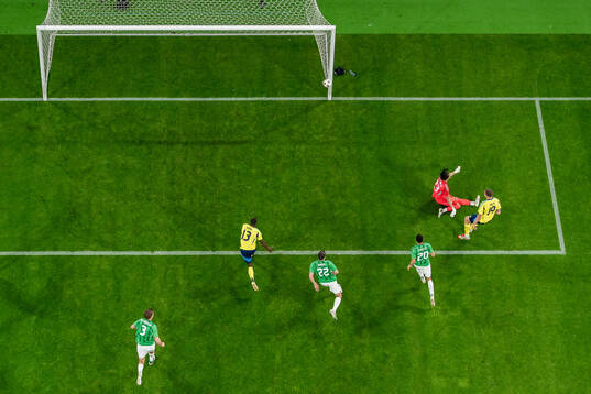 Emil Holm of Sweden scores the 1-0 goal against goalkeeper