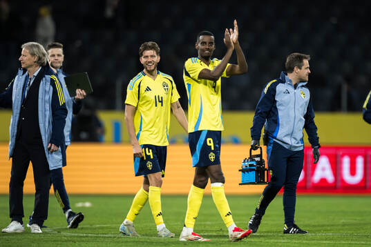 Anton Salétros and Alexander Isak of Sweden celebrate