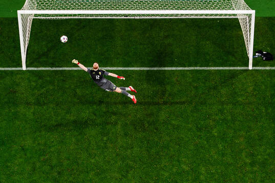 Goalkeeper Viktor Johansson of Sweden lets in the 5-1 goal