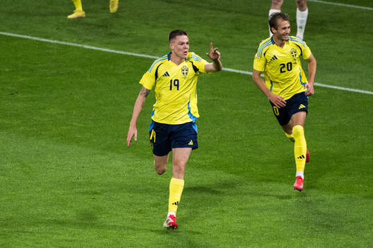 Emil Holm and Benjamin Nygren of Sweden celebrating the 1-0