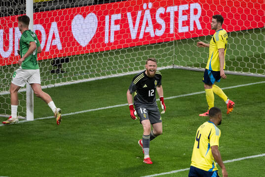 Goalkeeper Viktor Johansson and Isak Hien of Sweden