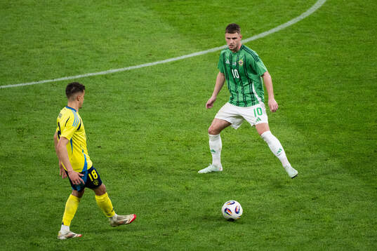 Yasin Ayari of Sweden and Jamie Donley of Northern Ireland
