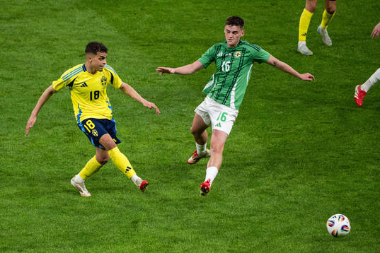Yasin Ayari of Sweden and Justin Devenny of Northern Ireland