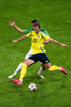 Brodie Spencer of Northern Ireland and Benjamin Nygren of