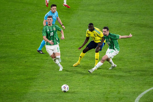 Ken Sema of Sweden against Jamie Donley and Ciaron Brown of