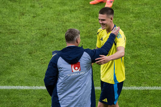 Emil Holm and Head coach Jon Dahl Tomasson of Sweden