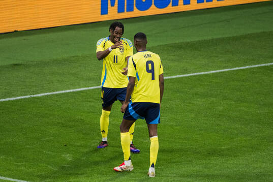 Anthony Elanga and Alexander Isak of Sweden celebrating the