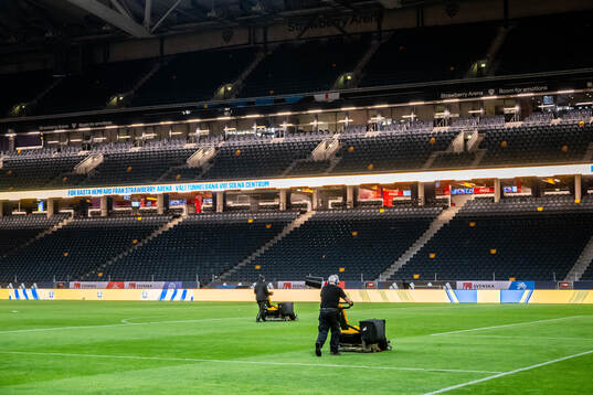 Ground Staff cutting the grass at Strawberry Arena