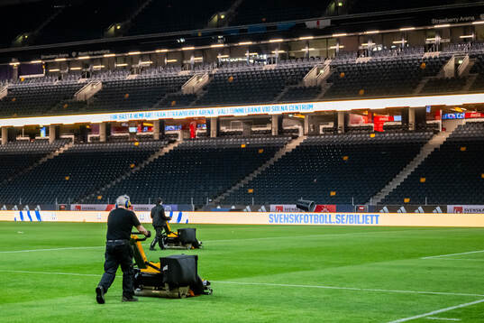 Ground Staff cutting the grass at Strawberry Arena