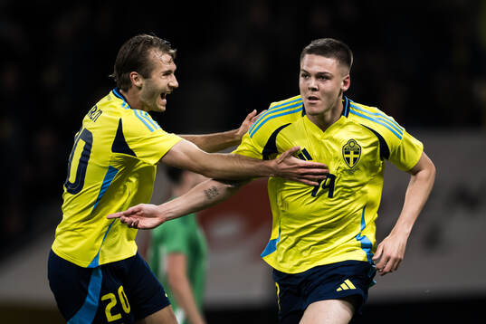 Benjamin Nygren and Emil Holm of Sweden celebrating scoring