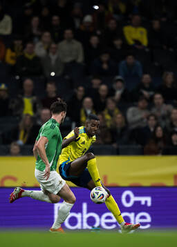 Paddy McNair of Northern Ireland and Alexander Isak of