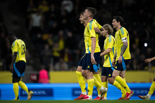 Benjamin Nygren and Emil Holm of Sweden celebrating the 2-0
