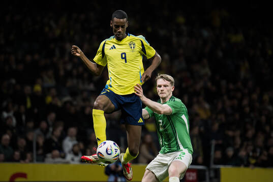 Alexander Isak of Sweden and Terry Devlin of Northern