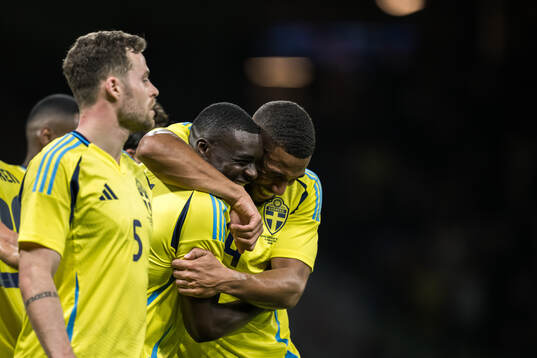 Ken Sema and Isak Hien of Sweden celebrating the 3-0 goal
