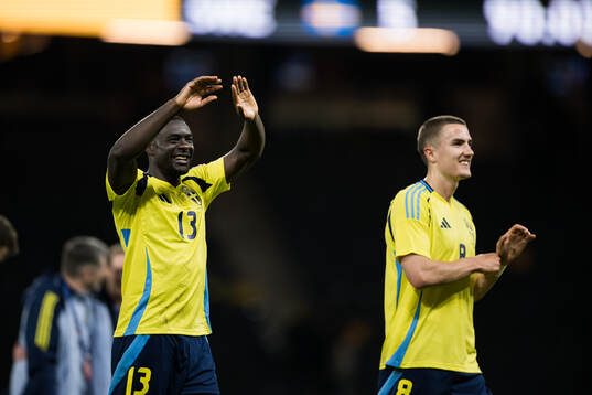 Ken Sema and Gustaf Lagerbielke of Sweden celebrate