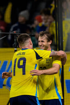 Emil Holm and Benjamin Nygren of Sweden celebrate the 2-0