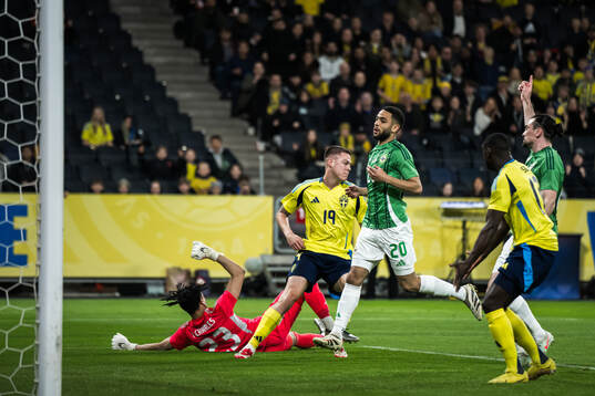 Emil Holm of Sweden scores the 1-0 goal against goalkeeper