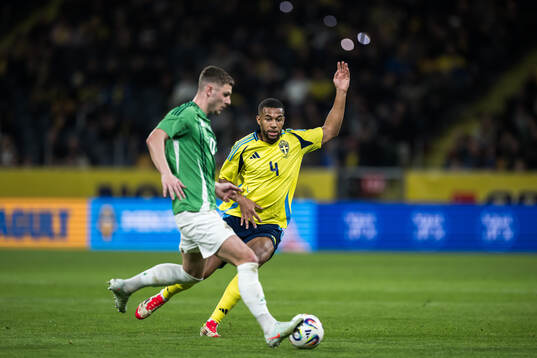 Jamie Donley of Northern Ireland and Isak Hien of Sweden