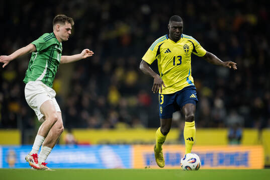 Justin Devenny of Northern Ireland and Ken Sema of Sweden