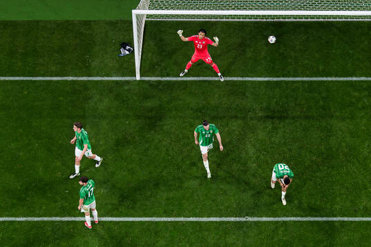Goalkeeper Pierce Charles of Northern Ireland looks dejected