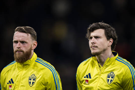 Goalkeeper Viktor Johansson and Victor Nilsson Lindelöf of