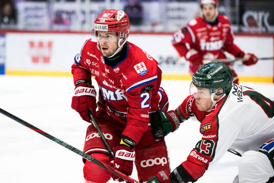 Timrås Filip Hållander och Frölundas Tom Nilsson