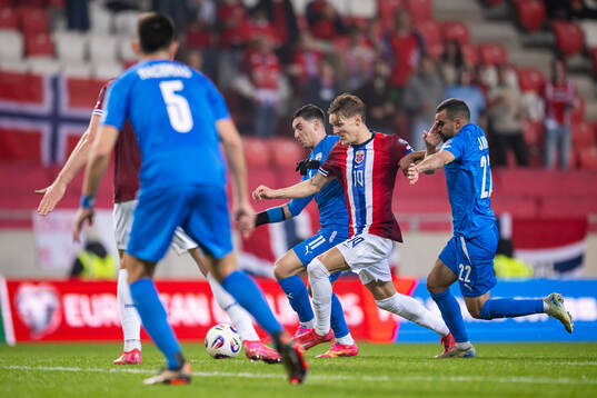 Martin Ødegaard of Norway and Eli Dasa of Israel